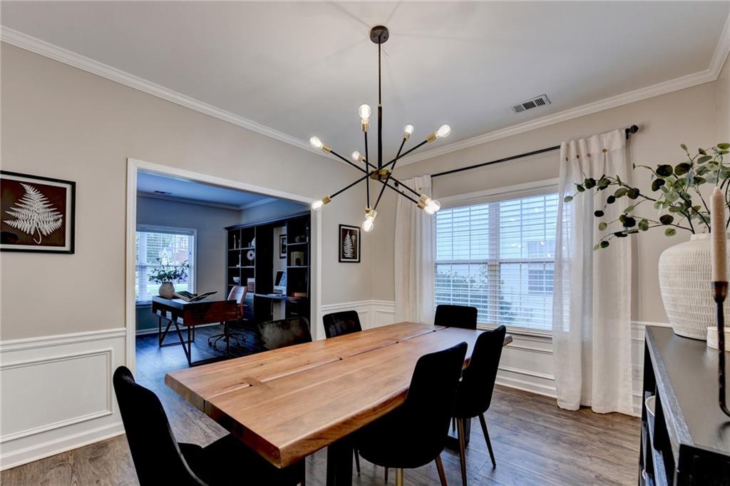 1130 Rome Drive Roswell, GA 30075 - Photo 18 of 96 a view of a dining room with furniture window and wooden floor