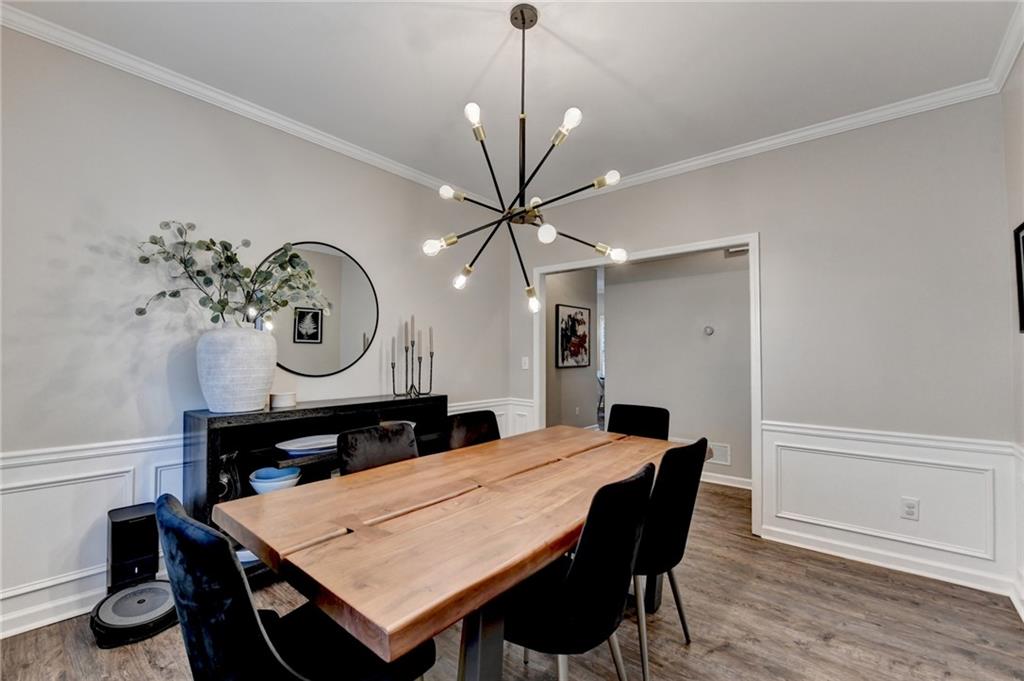 1130 Rome Drive Roswell, GA 30075 - Photo 20 of 96 a view of a dining room with furniture and wooden floor