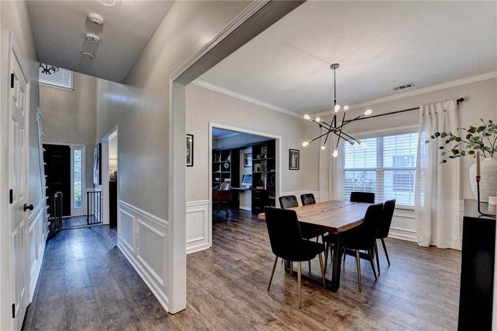 1130 Rome Drive Roswell, GA 30075 - Photo 21 of 96 a view of a dining room with furniture and wooden floor
