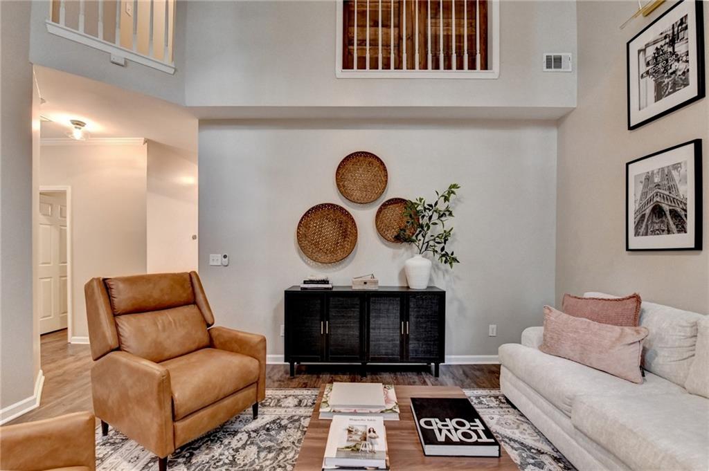 1130 Rome Drive Roswell, GA 30075 - Photo 26 of 96 a living room with furniture a rug and a fireplace