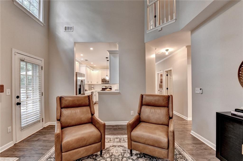 1130 Rome Drive Roswell, GA 30075 - Photo 30 of 96 a living room with furniture and a lamp