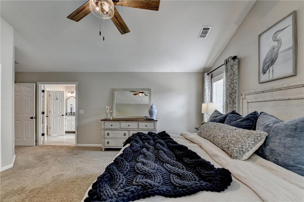 1130 Rome Drive Roswell, GA 30075 - Photo 53 of 96 a bedroom with a bed window and wall painting