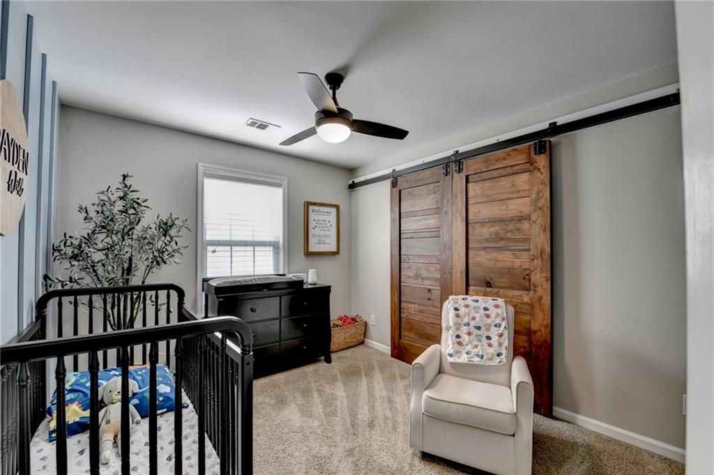 1130 Rome Drive Roswell, GA 30075 - Photo 67 of 96 a bedroom with furniture and a window