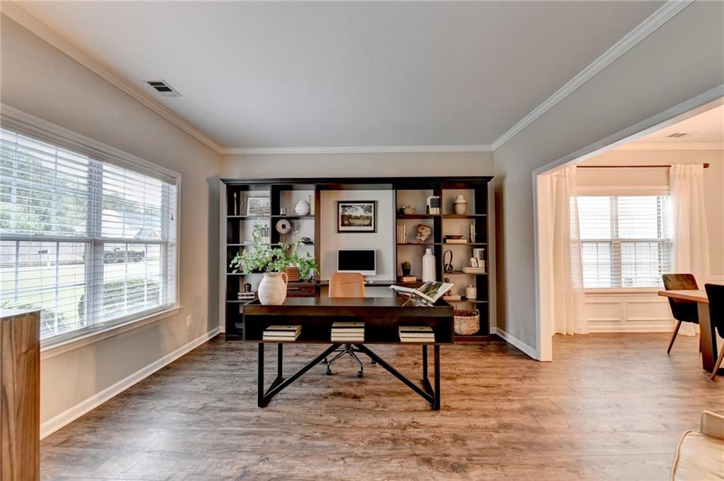 1130 Rome Drive Roswell, GA 30075 - Photo 7 of 96 a view of a workspace with furniture window and wooden floor