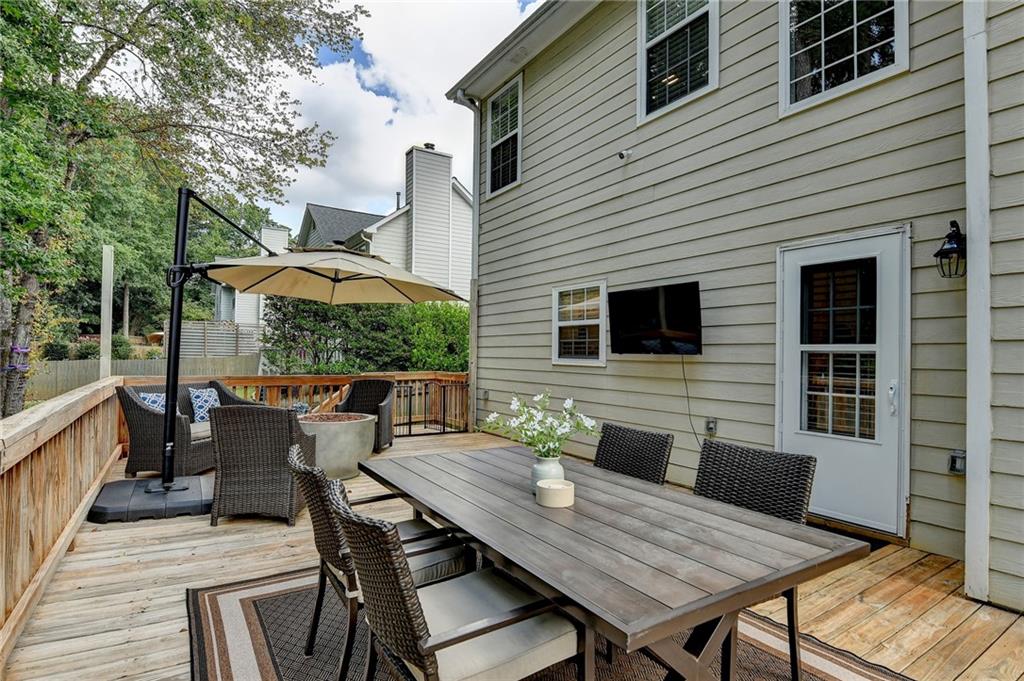 1130 Rome Drive Roswell, GA 30075 - Photo 84 of 96 a view of a patio with table and chairs