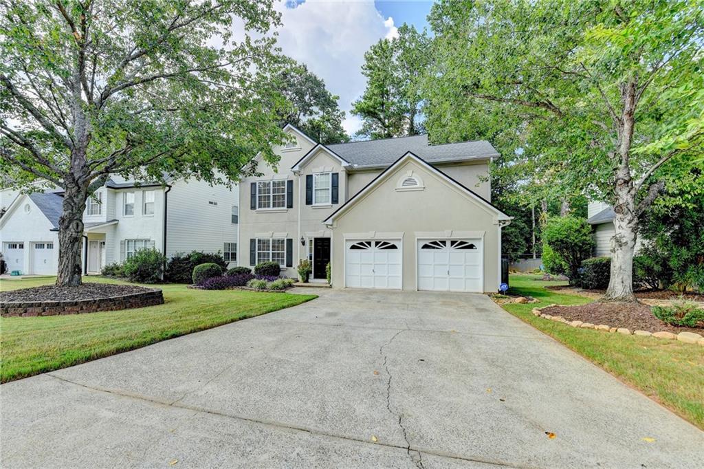 1130 Rome Drive Roswell, GA 30075 - Photo 94 of 96 a view of a house with a yard and large trees