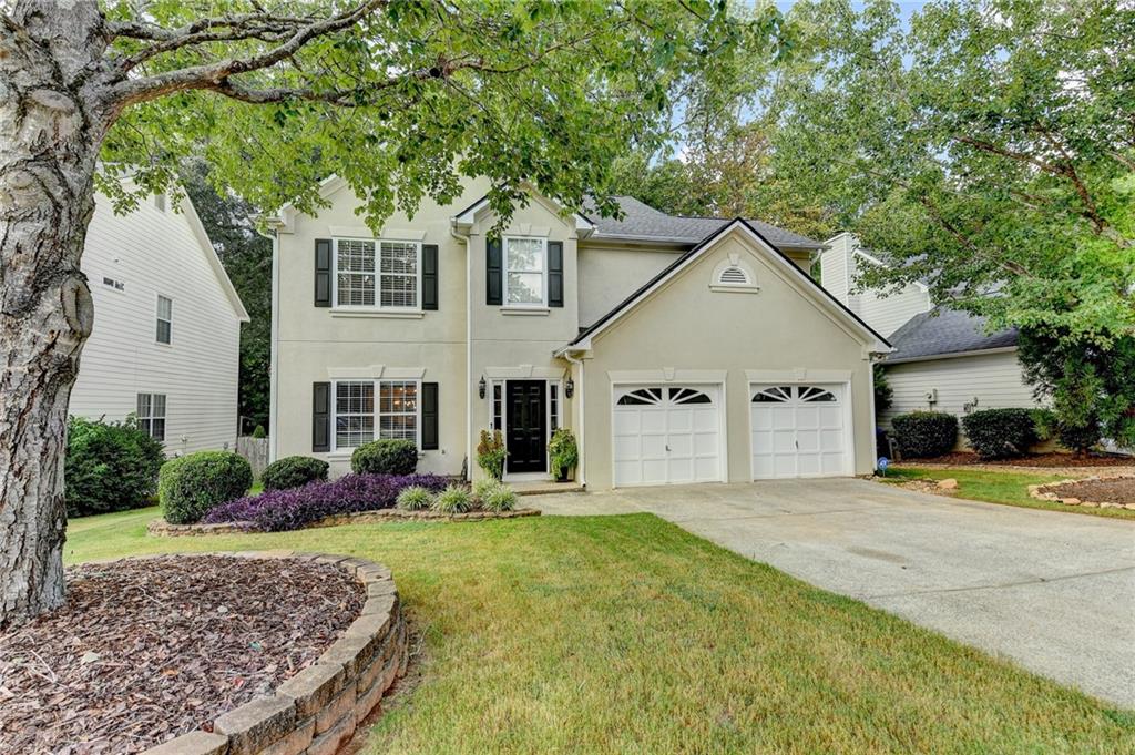 1130 Rome Drive Roswell, GA 30075 - Photo 96 of 96 a front view of a house with garden