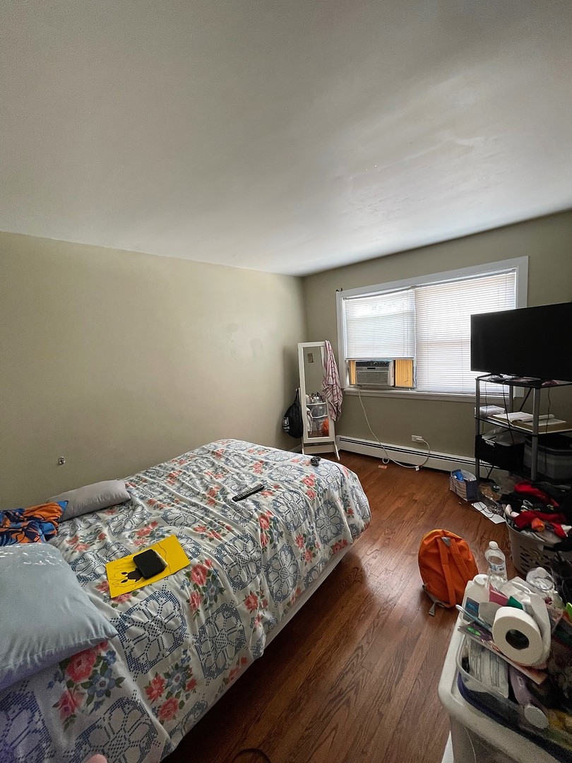 7240 Park Avenue Summit, IL 60501 - Photo 7 of 12 a bedroom with bed and window