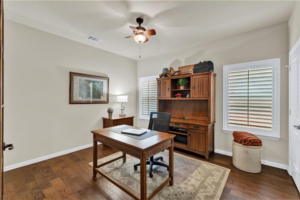 1701 Meadow Ranch Road McKinney, TX 75071 - Photo 6 of 40 a workspace with furniture window and wooden floor