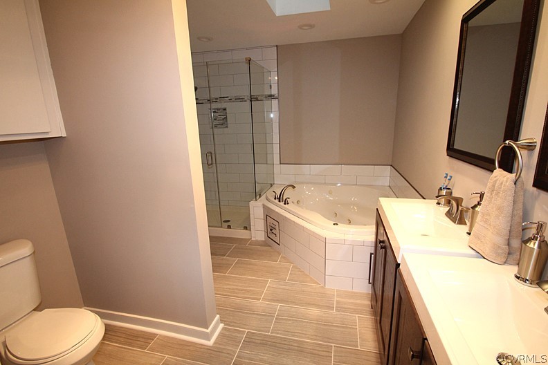 2809 Banbury Road Chester, VA 23831 - Photo 14 of 47 a bathroom with a sink toilet and shower