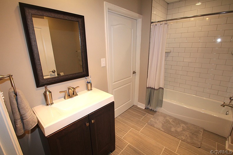 2809 Banbury Road Chester, VA 23831 - Photo 26 of 47 a bathroom with a sink and a mirror