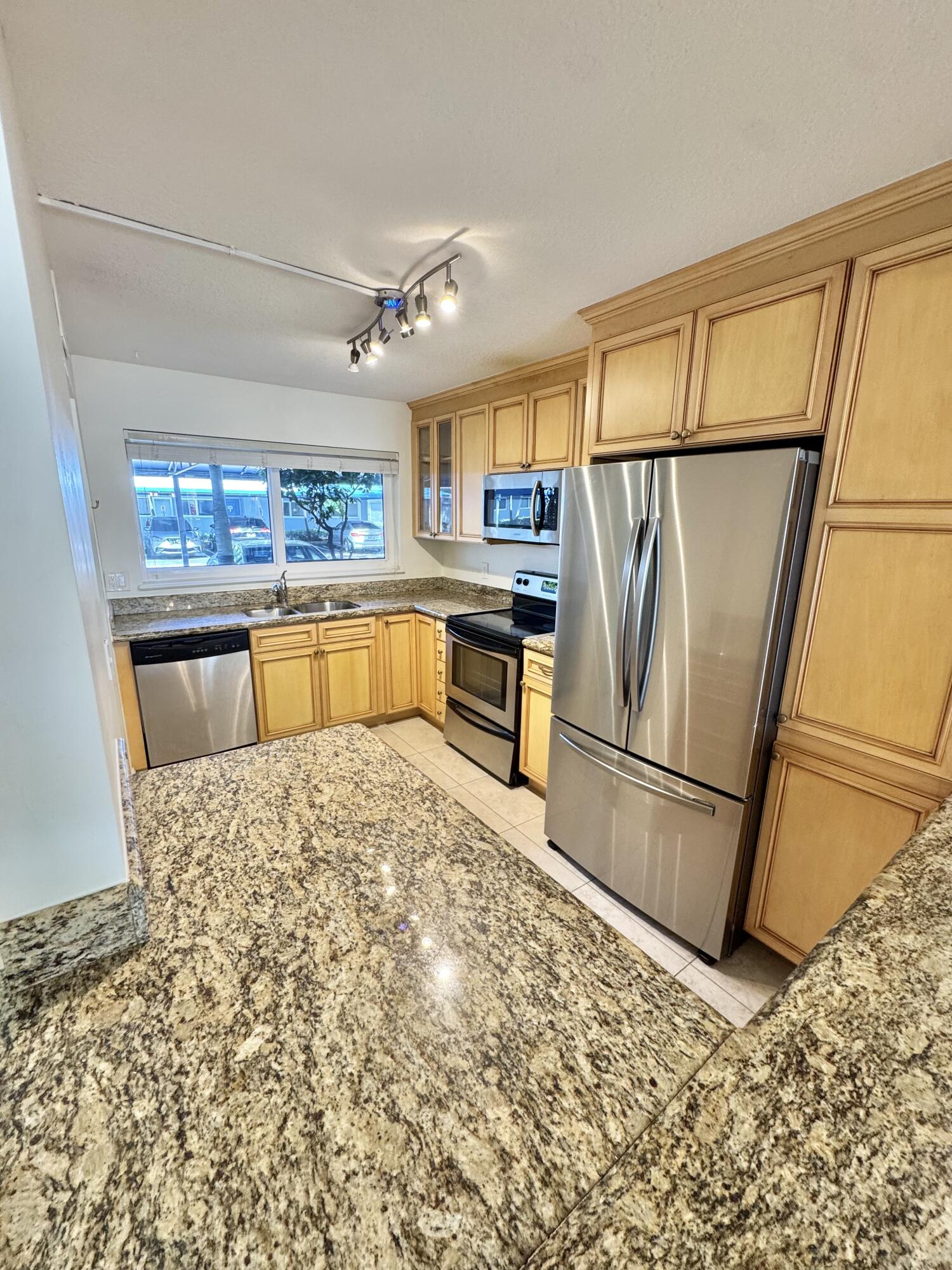 651 East Woolbright Road, Unit 103 Boynton Beach, FL 33435 - Photo 4 of 26 IMG_4749