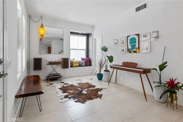 a living room with furniture and a rug