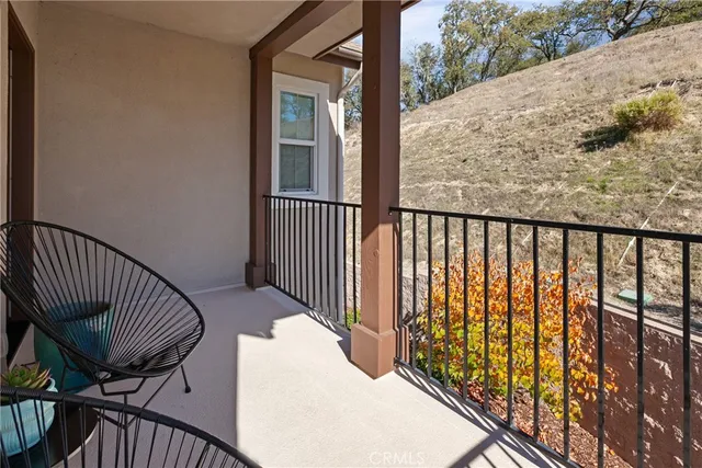 a view of a balcony with wooden floor