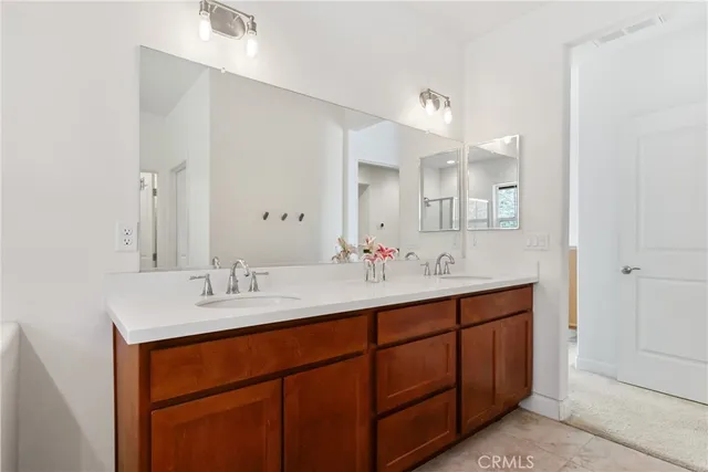 a bathroom with a granite countertop sink a toilet and bathtub