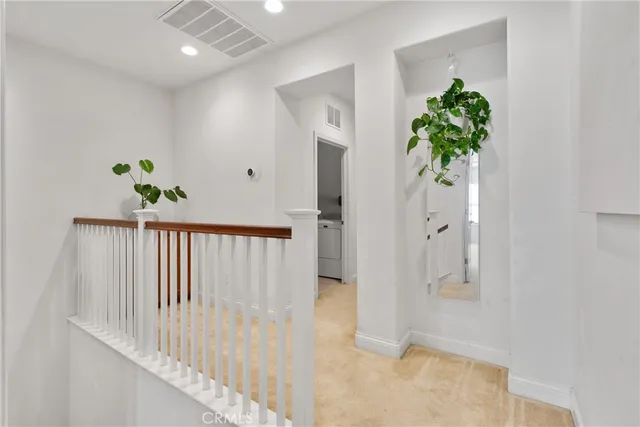 a view of a hallway with front door