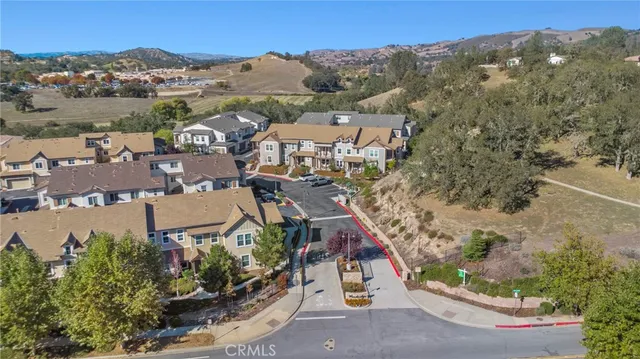 an aerial view of a house with a mountain view