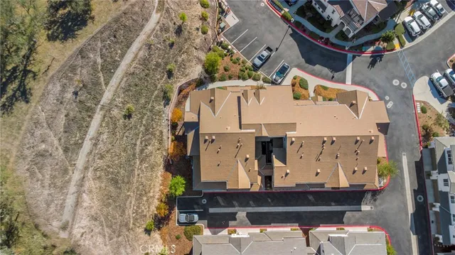 an aerial view of houses with outdoor space