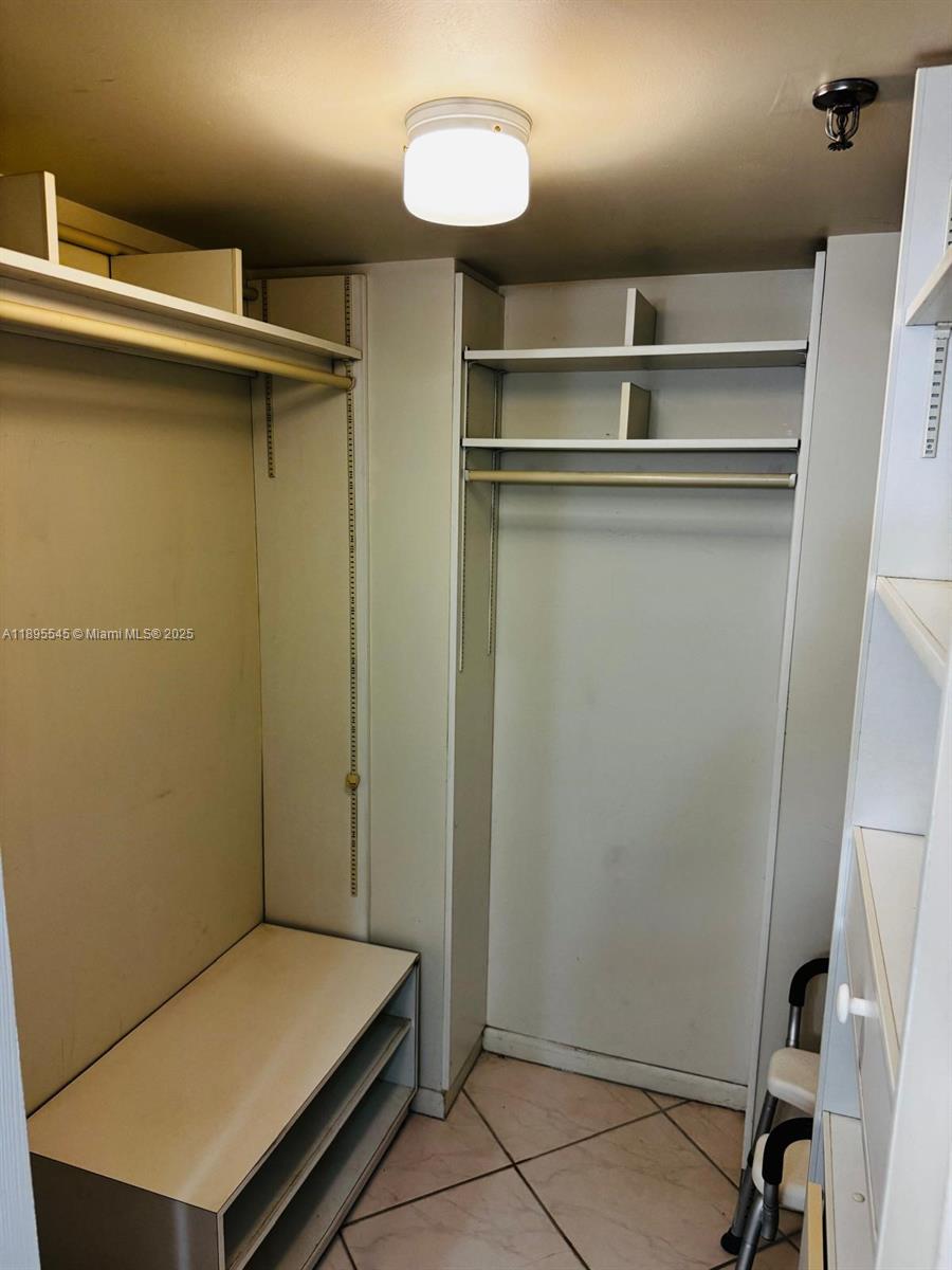 9156 Collins Avenue, Unit 310 Surfside, FL 33154 - Photo 13 of 22 a room with closet