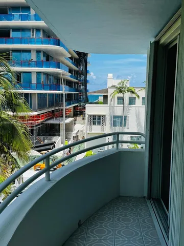 a view of swimming pool from a balcony