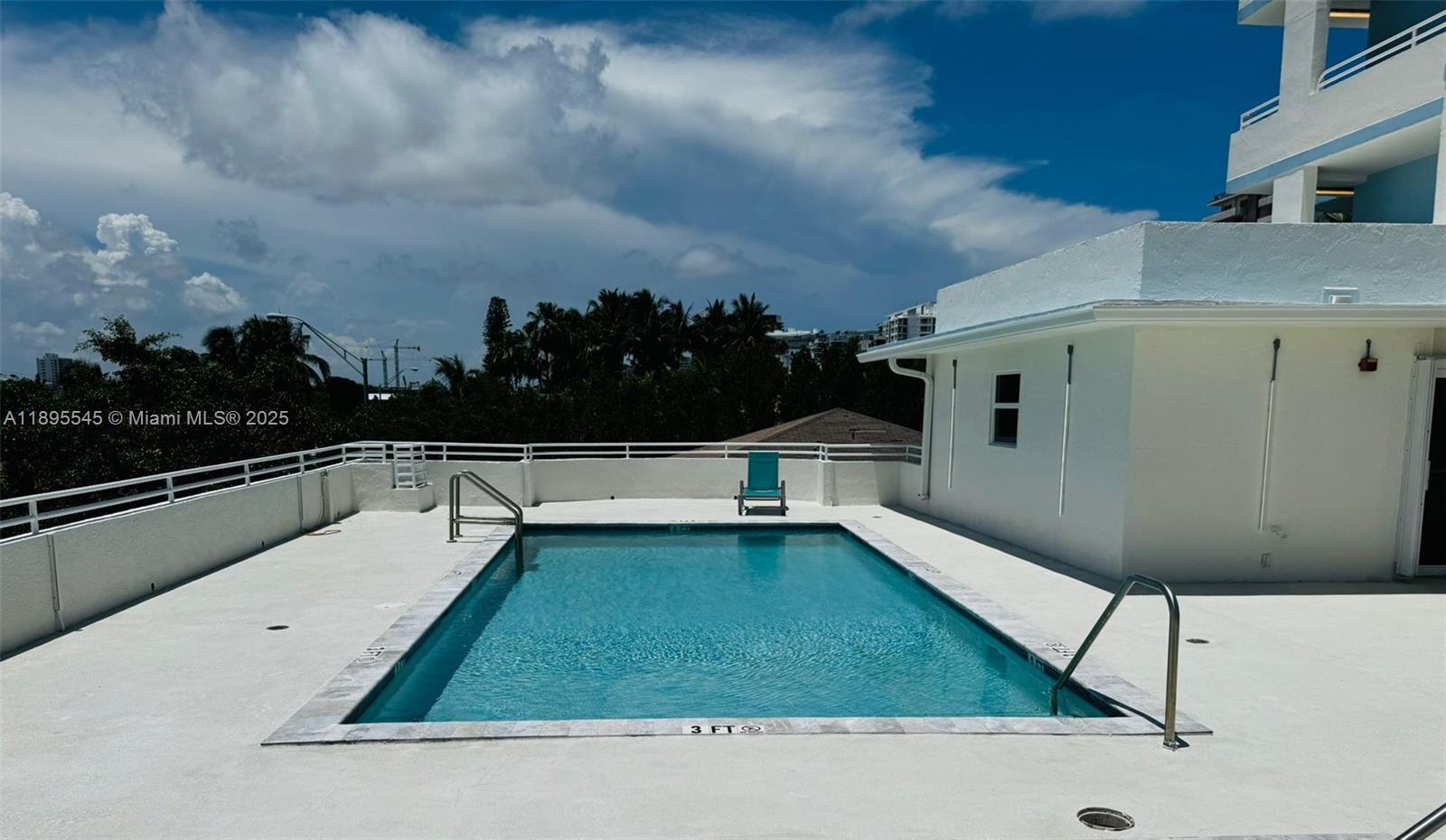 9156 Collins Avenue, Unit 310 Surfside, FL 33154 - Photo 18 of 22 a view of swimming pool from a balcony