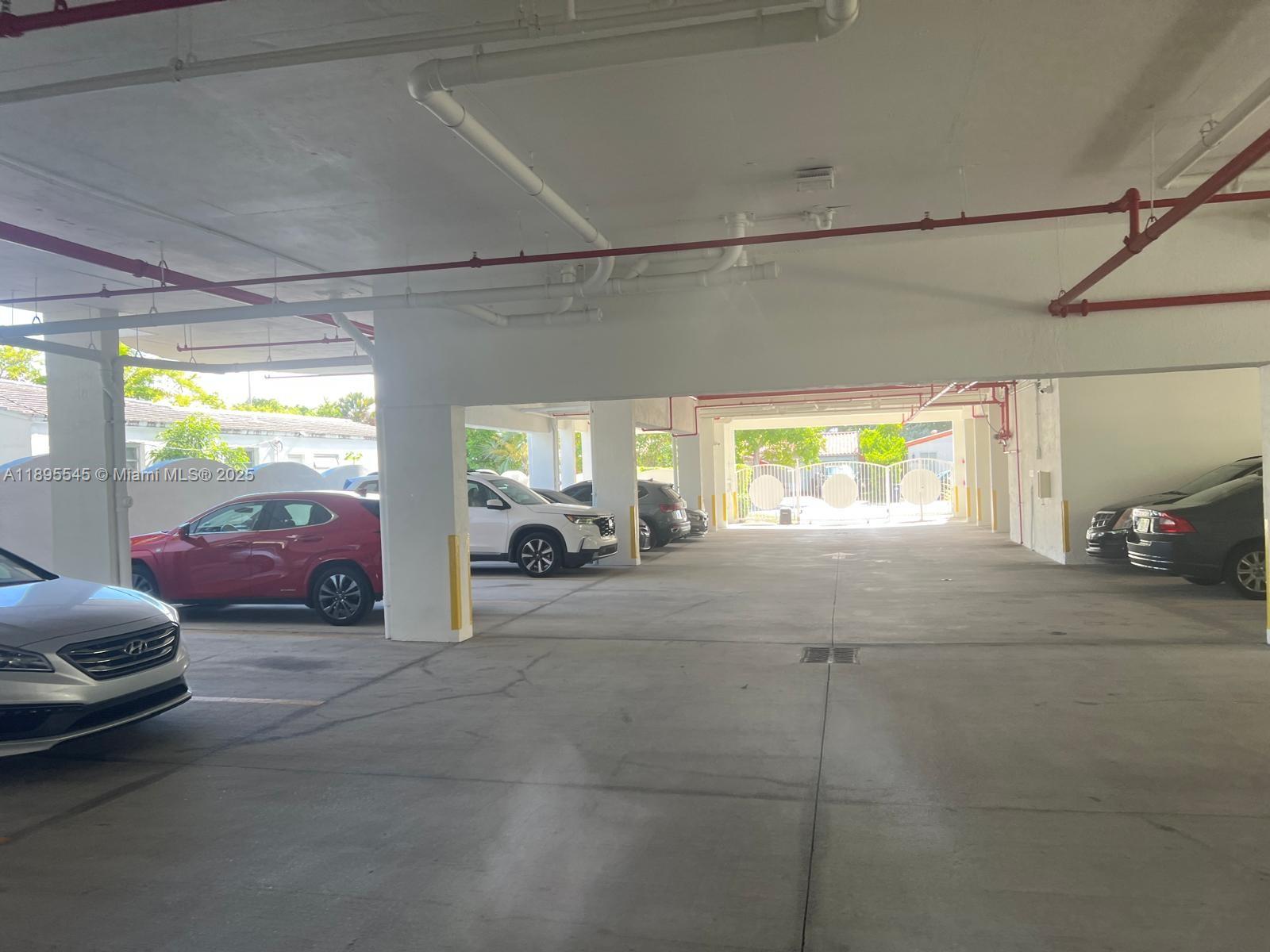9156 Collins Avenue, Unit 310 Surfside, FL 33154 - Photo 3 of 22 a view of parking area