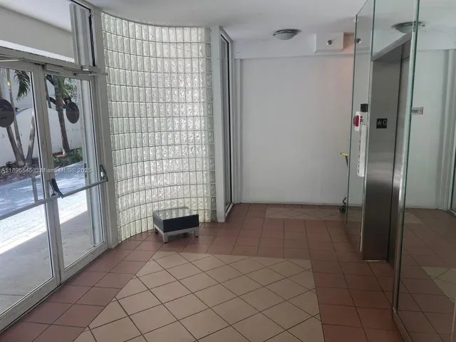 a view of empty room with windows