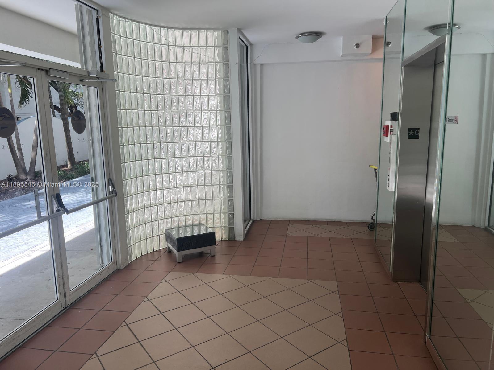 9156 Collins Avenue, Unit 310 Surfside, FL 33154 - Photo 5 of 22 a view of empty room with windows