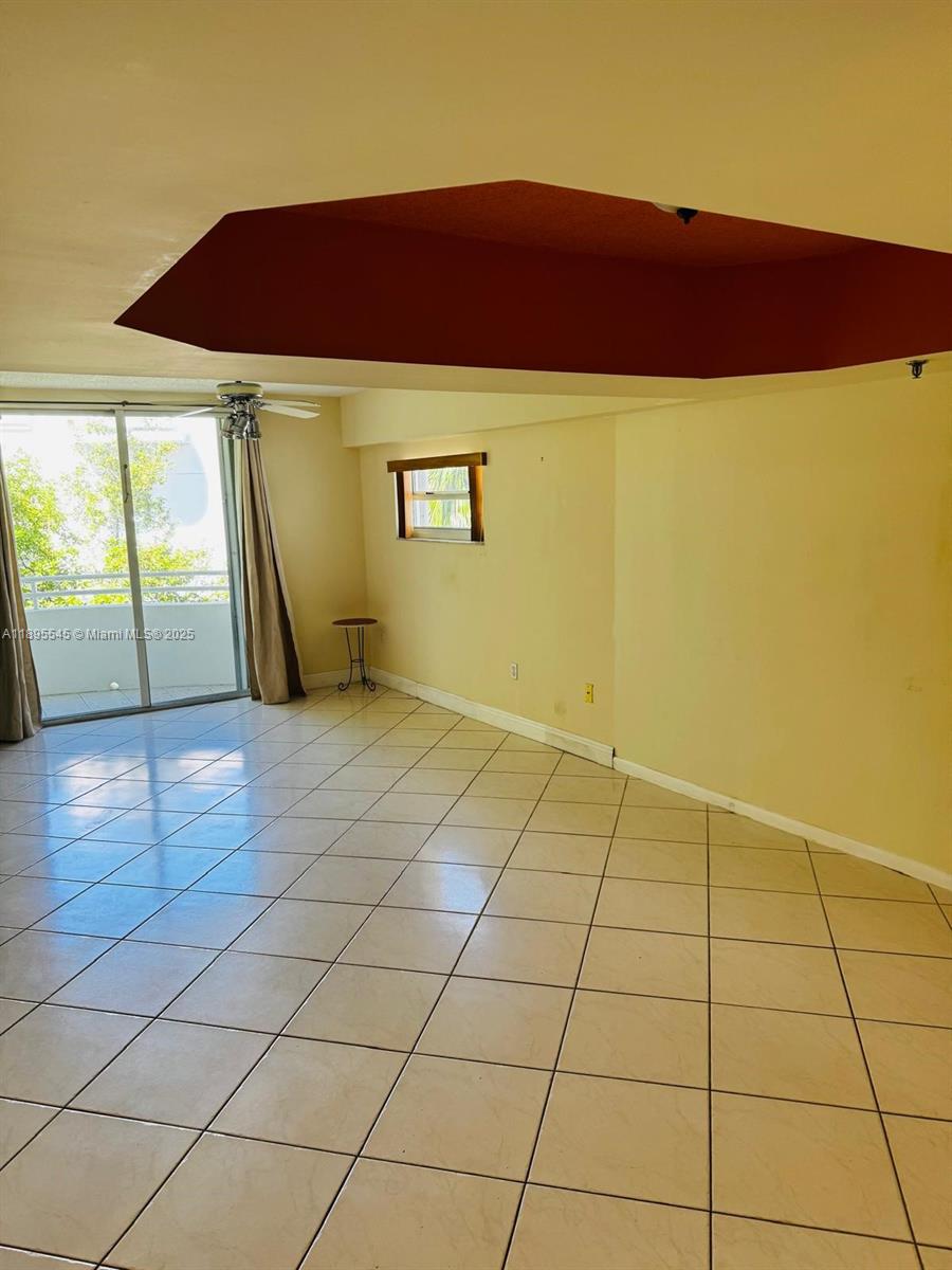 9156 Collins Avenue, Unit 310 Surfside, FL 33154 - Photo 7 of 22 a view of an empty room and window