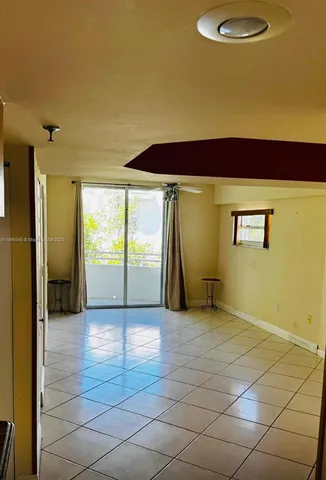 a kitchen with a stove a refrigerator and a sink