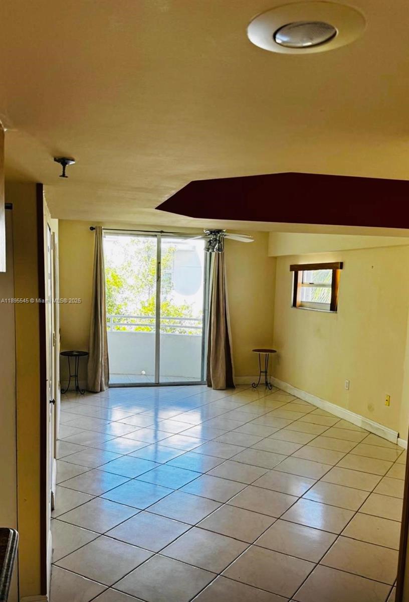 9156 Collins Avenue, Unit 310 Surfside, FL 33154 - Photo 9 of 22 a view of a livingroom with a staircase