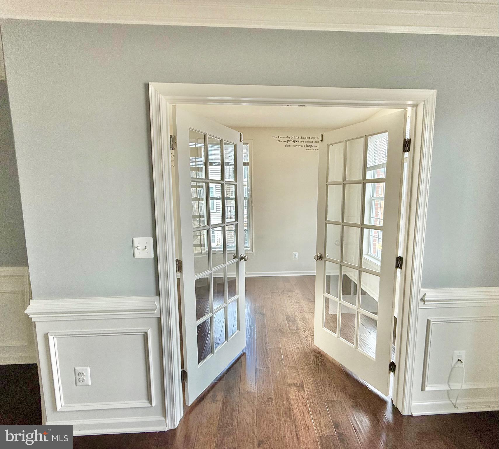 23479 Buckland Farm Terrace Ashburn, VA 20148 - Photo 14 of 17 a view of empty room with wooden floor and fan