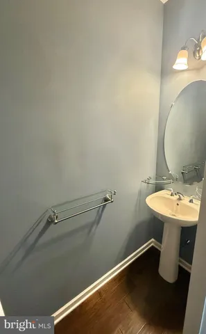 a bathroom with a sink and mirror