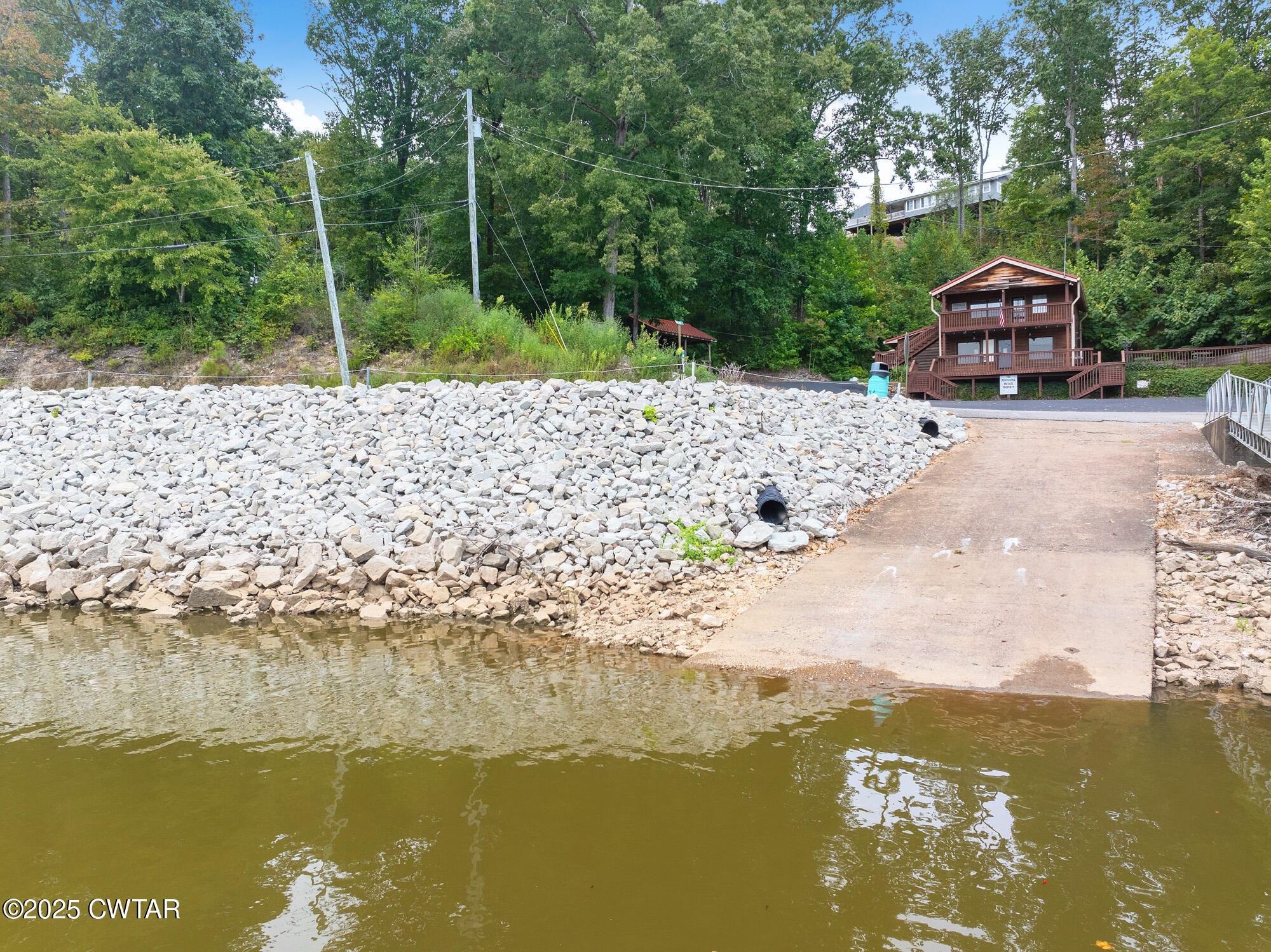 576 Ridgeway Road Sugar Tree, TN 38380 - Photo 60 of 66 a view of a lake with a house