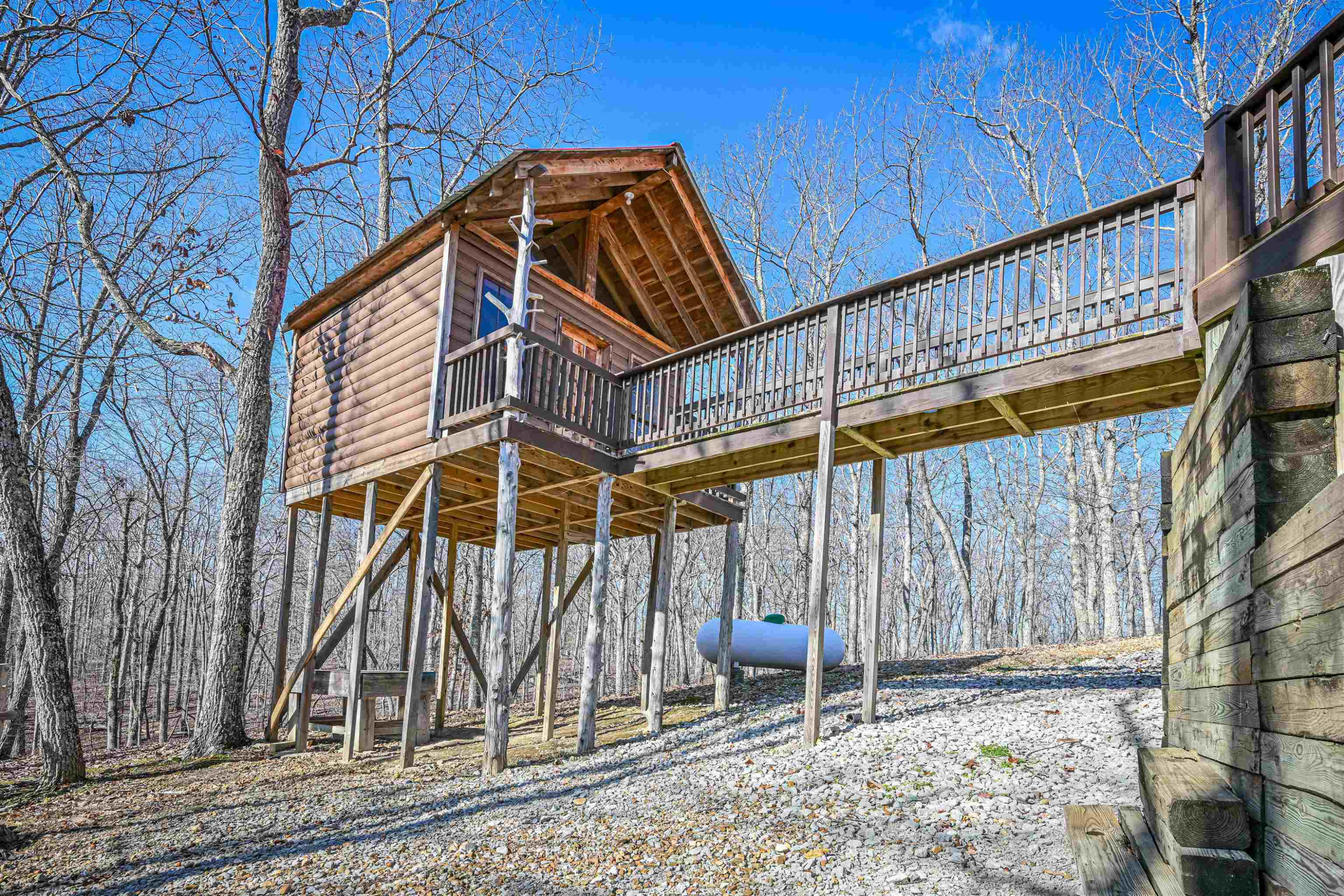 576 Ridgeway Road Sugar Tree, TN 38380 - Photo 7 of 66 a backyard of a house with barbeque oven table and chairs