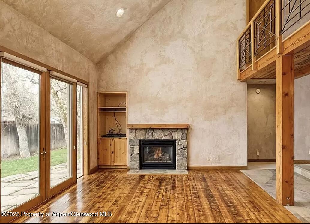 60 River Cove Basalt, CO 81621 - Photo 6 of 17 a view of an empty room with glass door and a fireplace