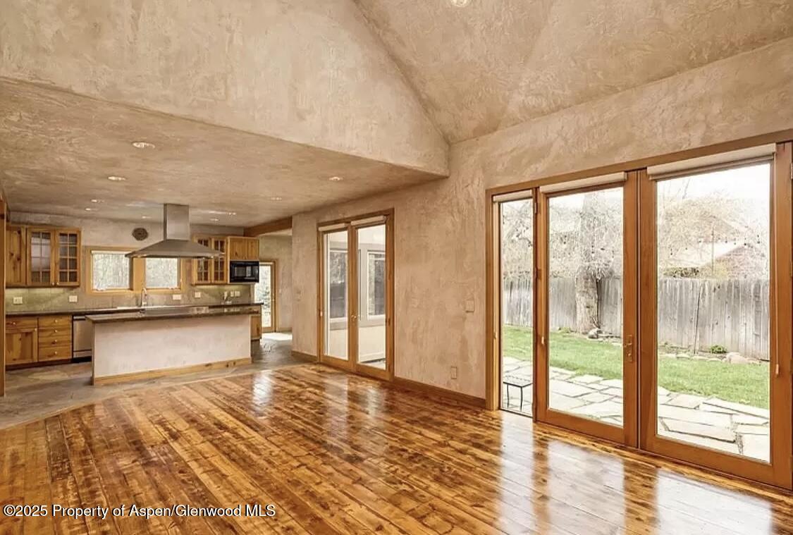 60 River Cove Basalt, CO 81621 - Photo 8 of 17 a view of a large room with kitchen and windows