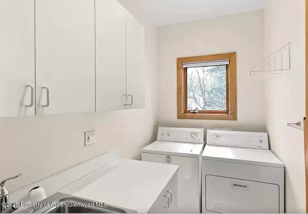 a bathroom with a sink and shower