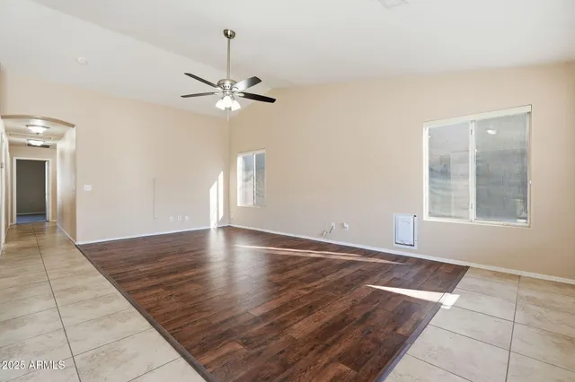 a kitchen with stainless steel appliances granite countertop a stove top oven a sink a counter top space and cabinets