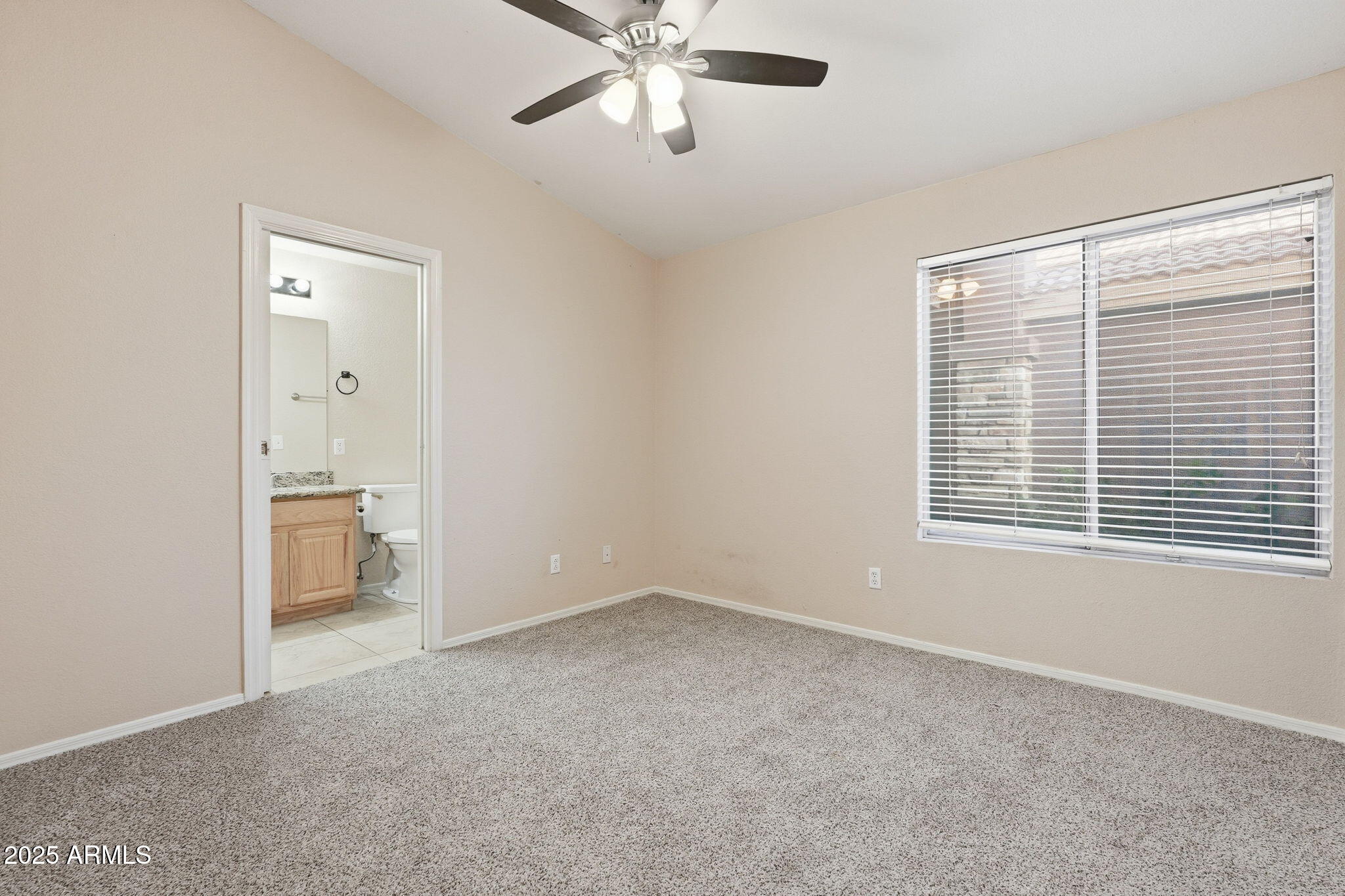 1619 East Carter Road Phoenix, AZ 85042 - Photo 24 of 56 a view of an empty room with a window