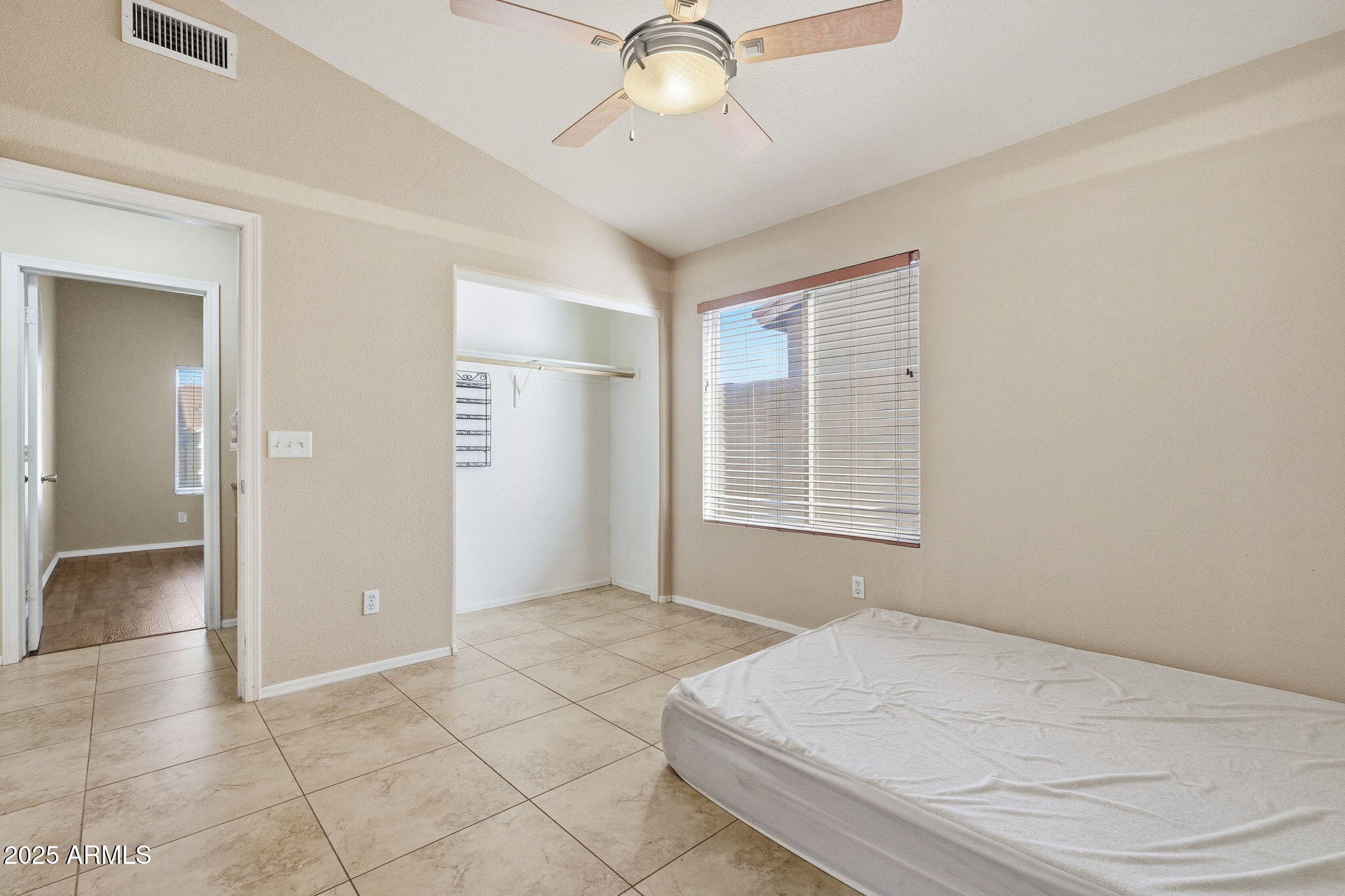 1619 East Carter Road Phoenix, AZ 85042 - Photo 31 of 56 a bedroom with a bed and a chandelier