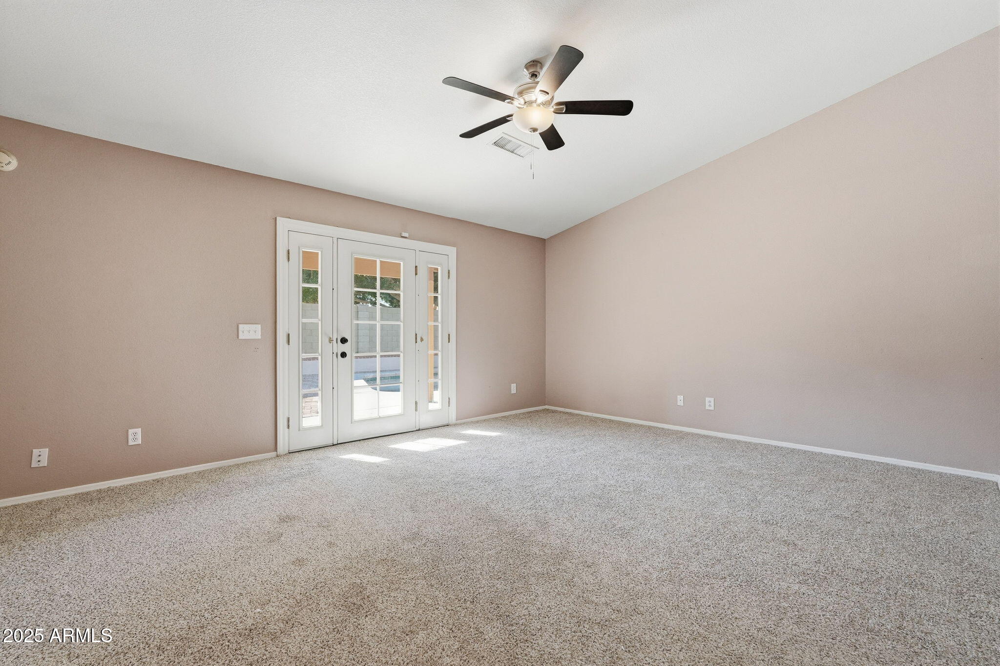 1619 East Carter Road Phoenix, AZ 85042 - Photo 32 of 56 a view of an empty room with a window