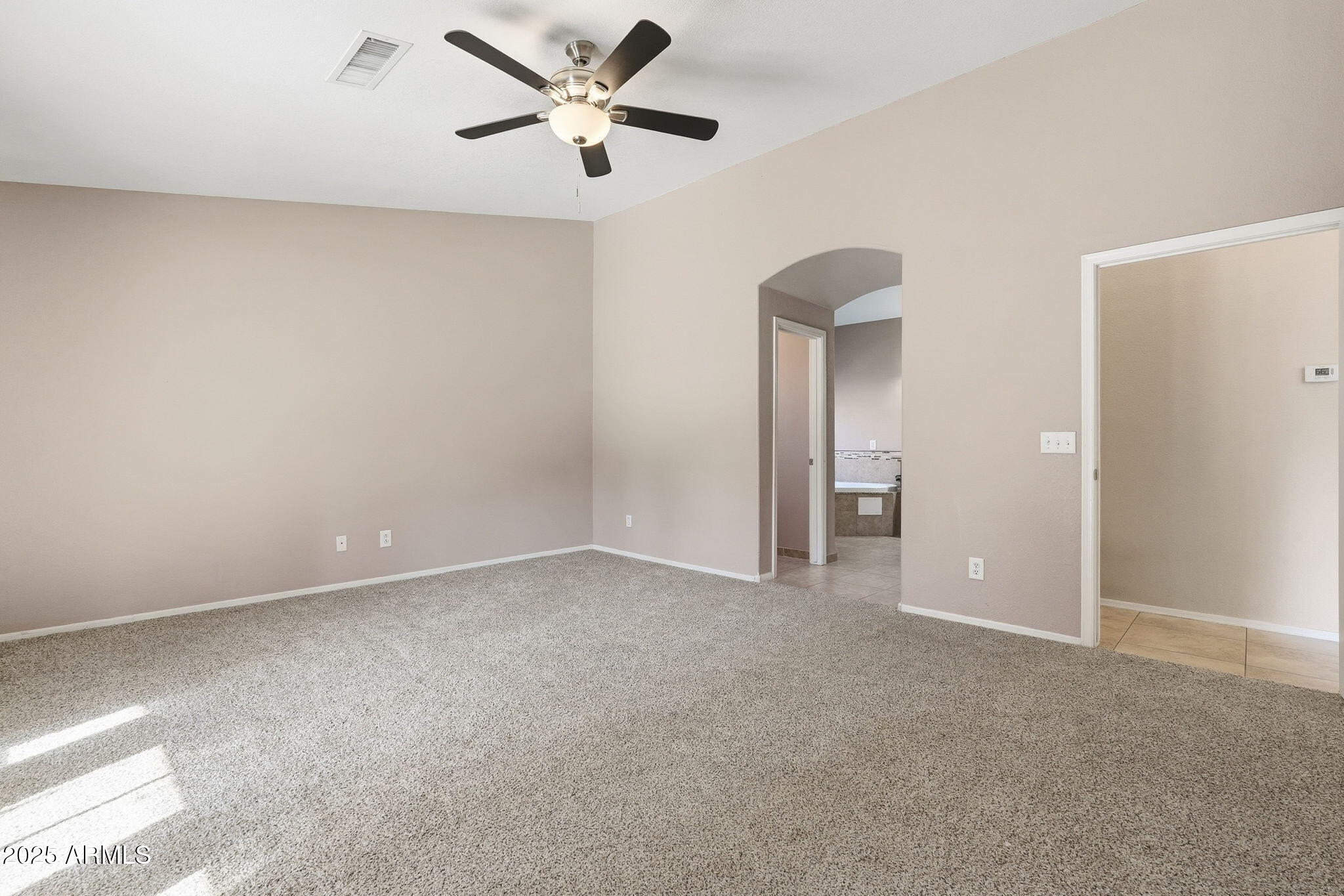 1619 East Carter Road Phoenix, AZ 85042 - Photo 33 of 56 a view of an empty room and chandelier fan