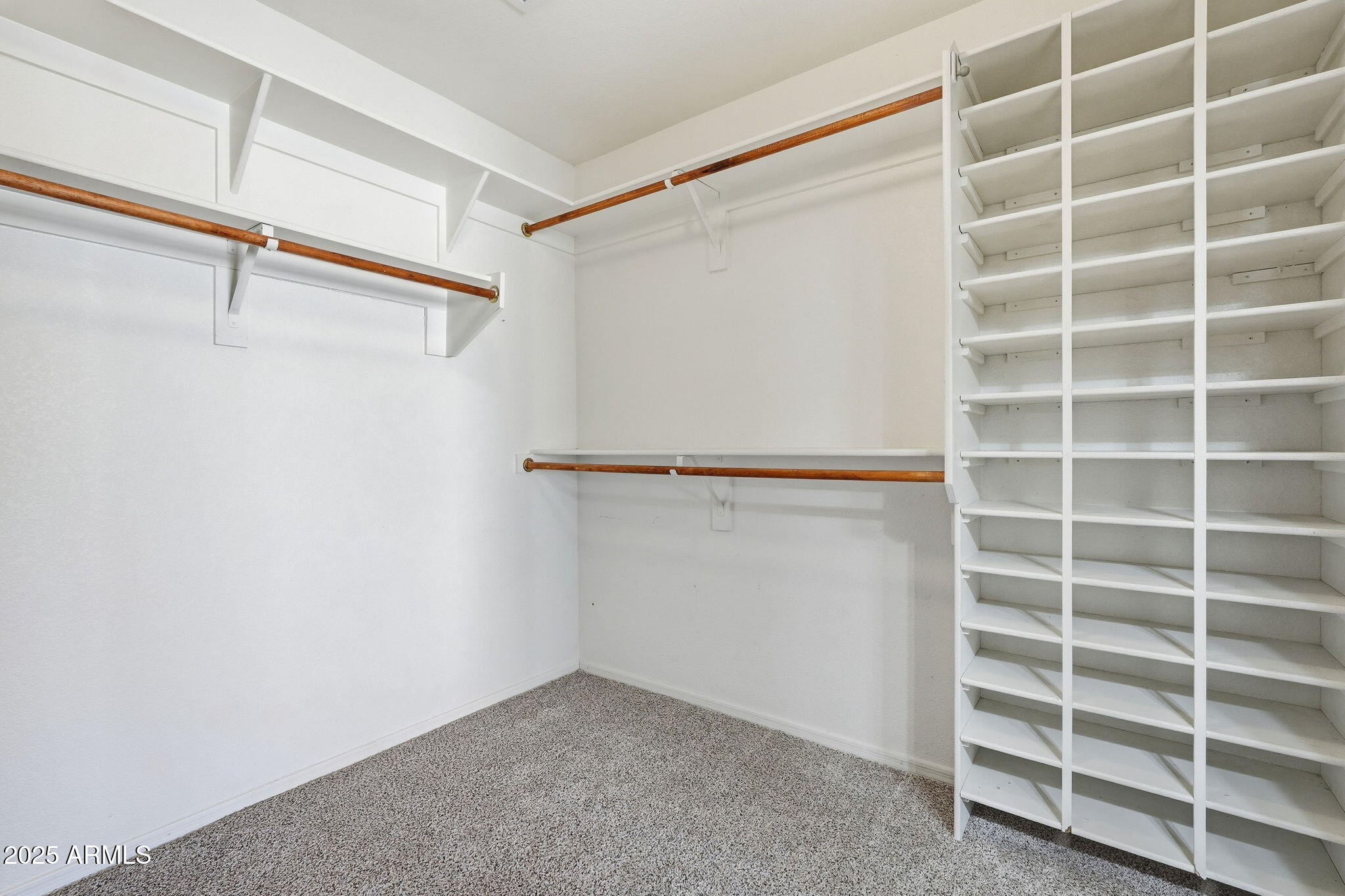 1619 East Carter Road Phoenix, AZ 85042 - Photo 36 of 56 a view of an empty walk in closet