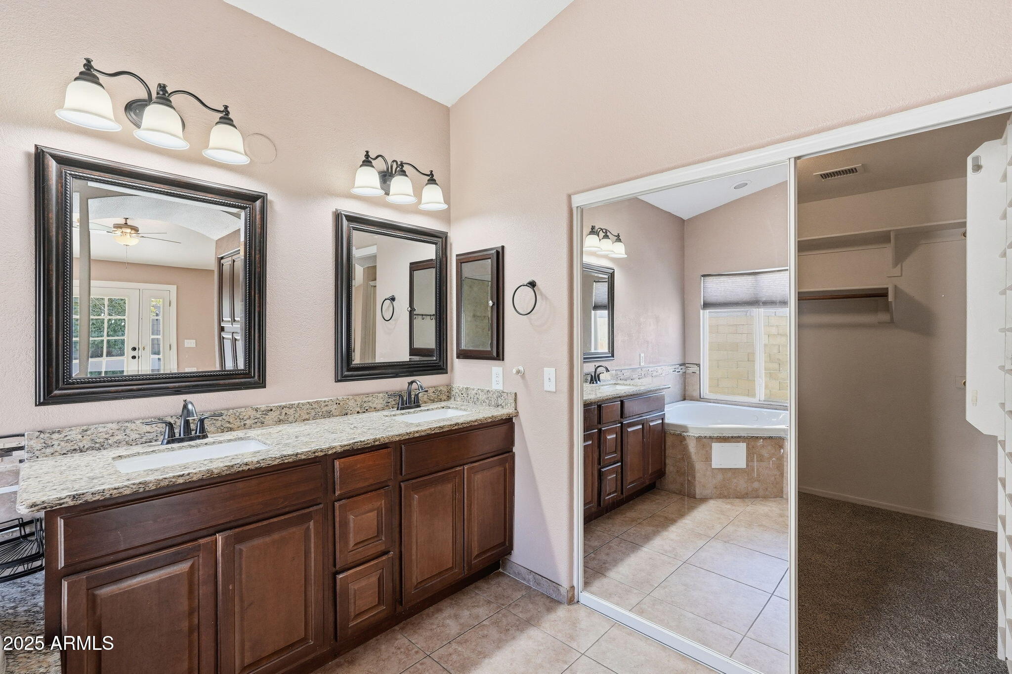 1619 East Carter Road Phoenix, AZ 85042 - Photo 42 of 56 a spacious bathroom with a double vanity sink shower and a mirror