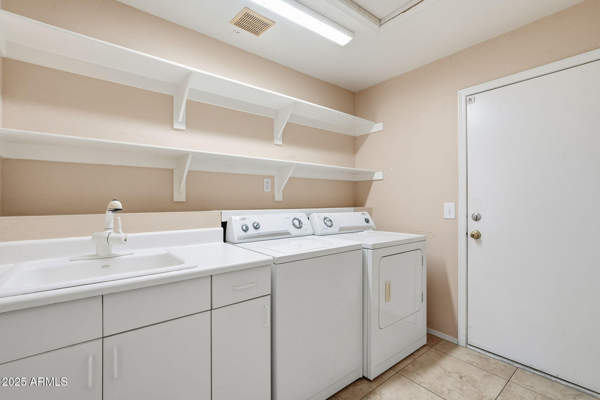 1619 East Carter Road Phoenix, AZ 85042 - Photo 43 of 56 a utility room with dryer and washer