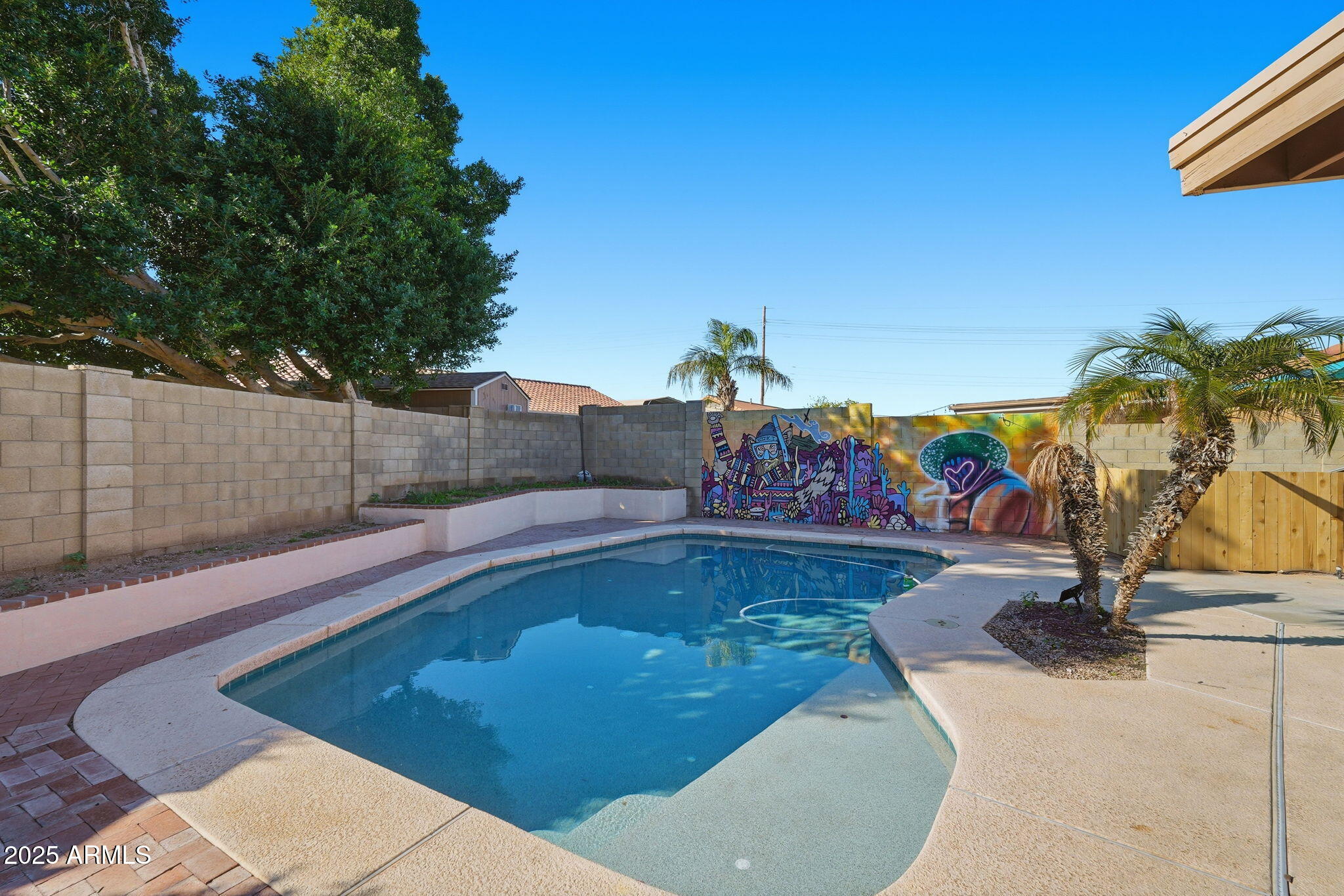 1619 East Carter Road Phoenix, AZ 85042 - Photo 50 of 56 a view of a swimming pool with an outdoor space