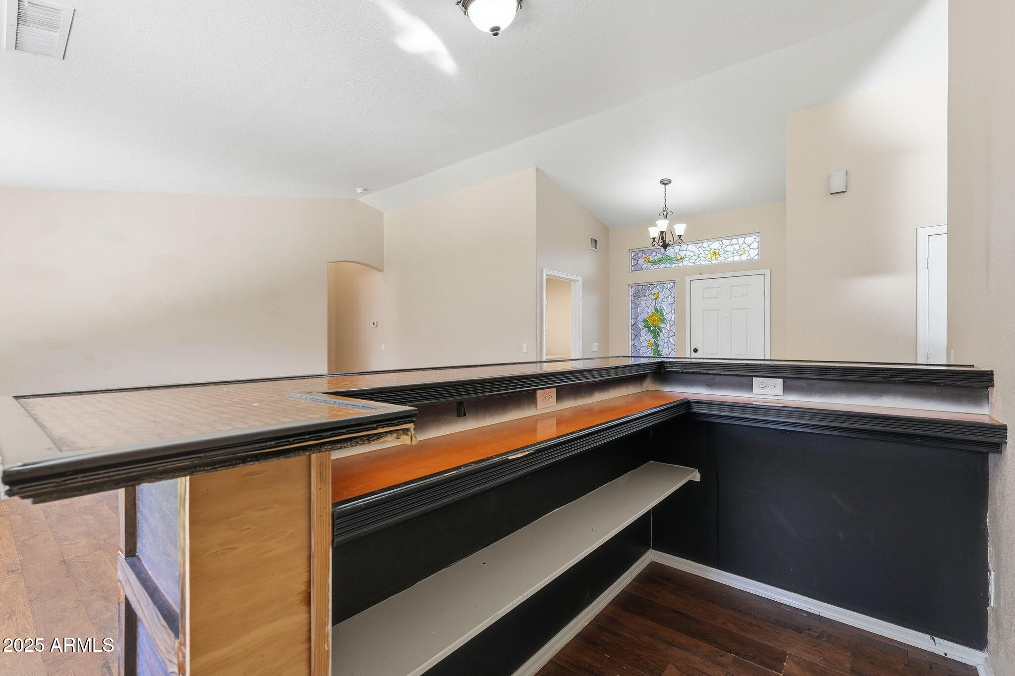 1619 East Carter Road Phoenix, AZ 85042 - Photo 6 of 56 a room with wooden floor and potted plant on a table