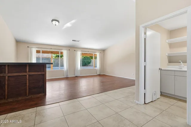 a view of wooden floor and windows in a room