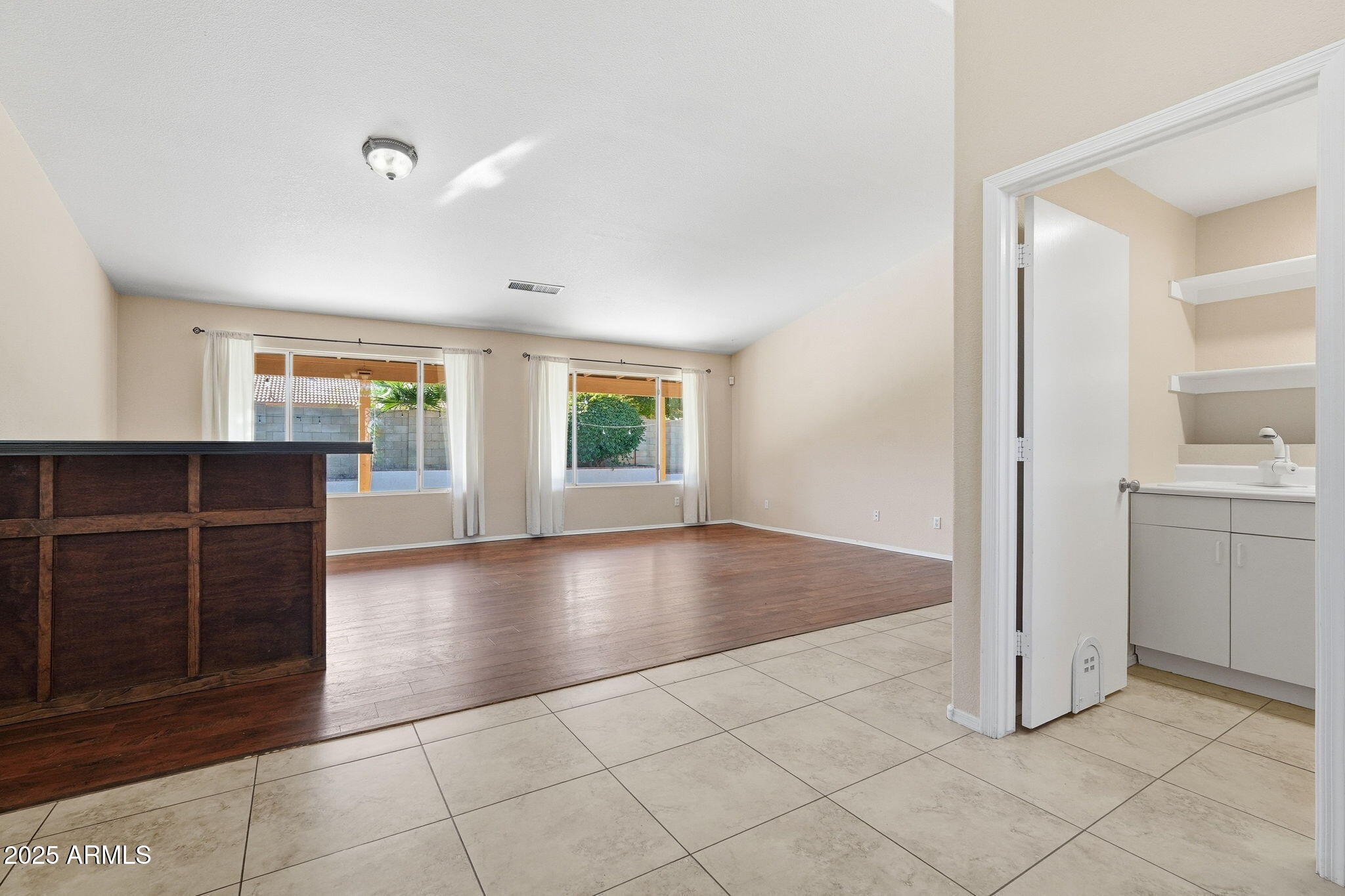1619 East Carter Road Phoenix, AZ 85042 - Photo 7 of 56 a view of a kitchen with a sink and a window